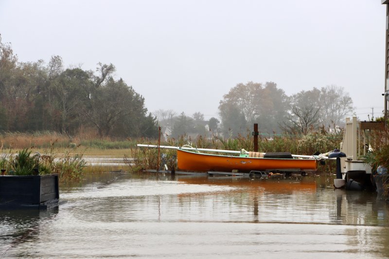 Water from the marsh crept up the side streets onto Cedar Street at high tide Oct. 13. BILL SHULL PHOTO